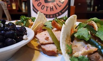Product: Roasted pork loin with chipotle ranch slaw, roasted serrano peppers and cilantro - Foothills Brewing in Winston Salem, NC American Restaurants