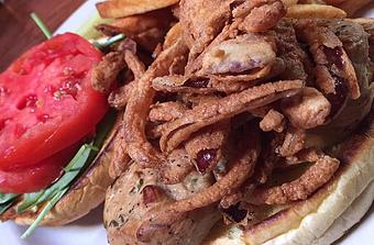 Product: Smoked chicken, spinach, tomato, fried onion straws and Worcestershire mayo on brioche - Foothills Brewing in Winston Salem, NC American Restaurants