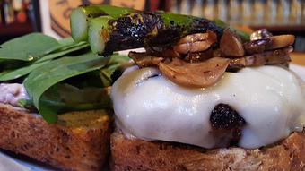 Product: Buffalo burger with aioli, spinach, swiss cheese, sautéed mushrooms and grilled asparagus - Foothills Brewing in Winston Salem, NC American Restaurants