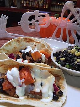 Product: Pulled pork, roasted papaya, black bean salsa, and lime sour cream. - Foothills Brewing in Winston Salem, NC American Restaurants
