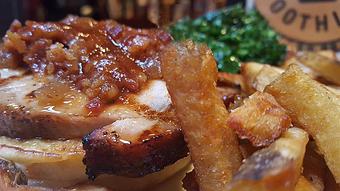 Product: Smoked pork loin, topped with bacon jam - Foothills Brewing in Winston Salem, NC American Restaurants