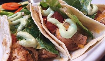 Product: Chipotle chicken taco with cheddar and pepper jack cheese, lettuce, tomatoes, and avocado lime sour cream. - Foothills Brewing in Winston Salem, NC American Restaurants