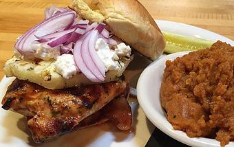 Product: Hoppyum BBQ chicken breast with grilled pineapple, bacon, red onion, and goat cheese on brioche. - Foothills Brewing in Winston Salem, NC American Restaurants