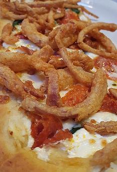 Product: Roasted garlic oil & ricotta cheese, topped with spinach, pepperoni, mozzarella,  provolone and fried onion straws - Foothills Brewing in Winston Salem, NC American Restaurants