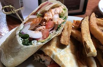 Product: Smoked salmon wrap with dill caper cream cheese, lettuce, tomato and onion - Foothills Brewing in Winston Salem, NC American Restaurants