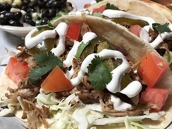 Product: Pulled pork, cabbage, tomato, lime sour cream, cilantro and pickled jalapeños - Foothills Brewing in Winston Salem, NC American Restaurants