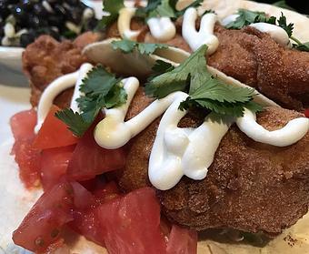 Product: Fried pollack, cabbage, tomato, sour cream and cilantro - Foothills Brewing in Winston Salem, NC American Restaurants