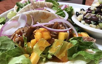 Product: Pulled pork tacos with lettuce, onions and mango habanero salsa - Foothills Brewing in Winston Salem, NC American Restaurants