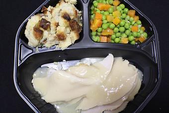Product: Roast Turkey with herb stuffing, gravy, peas and carrots - Franconia Heritage Restaurant in Telford, PA American Restaurants