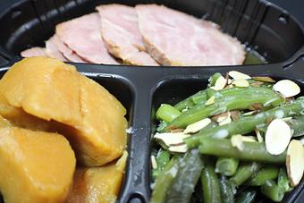 Product: Baked Pit Ham with candied yams and green beans almondine - Franconia Heritage Restaurant in Telford, PA American Restaurants