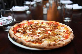 Product: Spicy Sausage & Caramelized Onion Pizza - Frankie and Fanucci's Wood Oven Pizzeria in Mamaroneck Village - Mamaroneck, NY Italian Restaurants