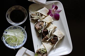Product: A young duckling slowly grilled until crispy & golden, sliced then served with homemade crepes, spring onion brushes & hoisin sauce - Fu's Chinese Restaurant and Sushi Bar in Sparta, NJ Japanese Restaurants