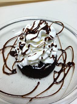Product: Vanilla ice cream swirled with fudge, surrounded with a cookie crumb and topped with whipped cream and chocolate syrup. - Gaetano's Tavern On Main in Wallingford, CT American Restaurants