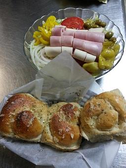 Product: Greek Salad served with fresh bread knots - Gigi's Italian Restaurant in Sorrento, FL Italian Restaurants