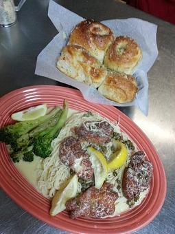 Product: Grouper Piccata with angel hair pasta and knots loaded with fresh garlic butter - Gigi's Italian Restaurant in Sorrento, FL Italian Restaurants