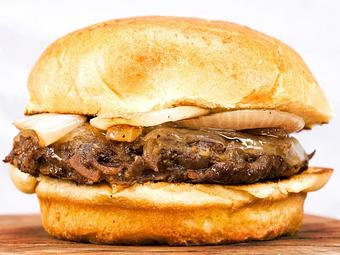 Product: Infused with onion and spices, topped with caramelized onions - Gimme A Burger in Deerfield Beach - Deerfield Beach, FL Hamburger Restaurants