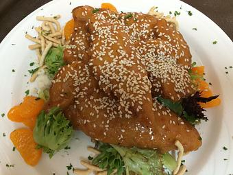 Product: Crispy chicken filets, tossed in sesame dressing - Grand Valley Inn in New Brighton, PA American Restaurants