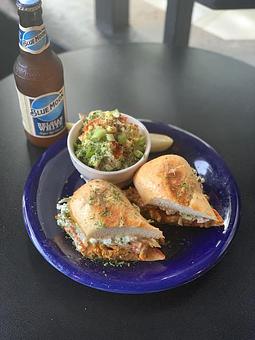 Product: Pig Destroyer -  Pulled “pork” slow cooked in Carolina style BBQ with all the necessary tang and bite topped with our house made creamy slaw and tangy red onions in a toasted hoagie roll. It’s saucy, drippy, messy, and utterly delicious. - Highline Bar in Capital Hill - Seattle, WA Bars & Grills