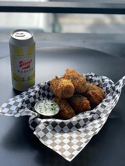 Product: Pickle spears – sliced dill pickles beer battered and fried golden w/ a side of dipping ranch. These things are delicious! - Highline Bar in Capital Hill - Seattle, WA Bars & Grills