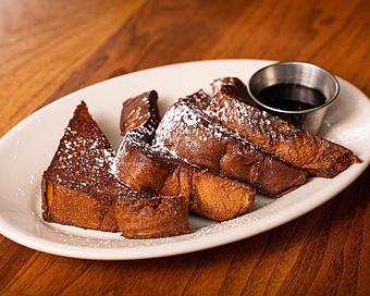 Product: brioche french toast crusted with cinnamon sugar. served with warm maple syrup and whipped butter - Hub 51 in River North - Chicago, IL American Restaurants
