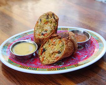 Product: housemade egg roll filled with chicken, cabbage and carrots, served with sweet and sour sauce - Hub 51 in River North - Chicago, IL American Restaurants