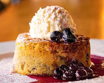 Product: fluffy housemade butter cake is infused with blueberries and topped with plump, fresh blueberries. served with vanilla bean whipped cream - Hub 51 in River North - Chicago, IL American Restaurants