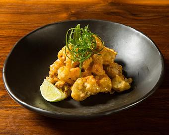 Product: tempura fried cauliflower tossed with spicy miso mayo. finished with togarashi, scallion and lime - Hub 51 in River North - Chicago, IL American Restaurants