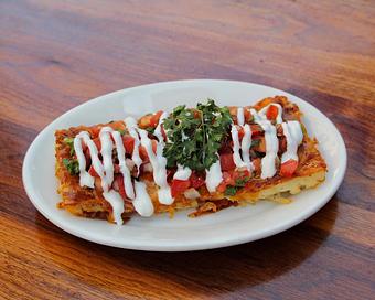 Product: housemade shredded hash browns topped with melted cheddar cheese, pico de gallo and sour cream - Hub 51 in River North - Chicago, IL American Restaurants