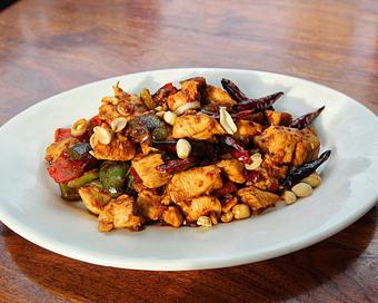 Product: chicken breast is cooked in the wok with kung pao chili sauce, red and green peppers and peanuts. served with white rice. - Hub 51 in River North - Chicago, IL American Restaurants