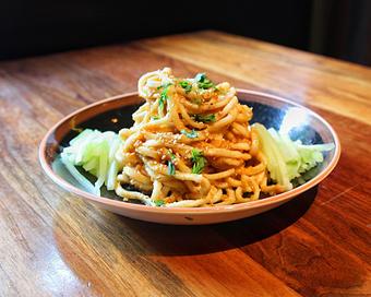 Product: chinese wheat noodles are served chilled. tossed with spicy peanut sauce. served with cucumber and cilantro - Hub 51 in River North - Chicago, IL American Restaurants