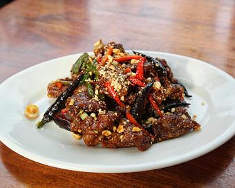 Product: a ben pao favorite! crispy steak tossed in a sauce of chilies, lemongrass, peanuts and thai basil. topped with roasted peanuts. served with white rice - Hub 51 in River North - Chicago, IL American Restaurants