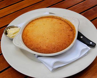 Product: homemade cornbread is filled sweet corn. baked in a skilled until golden brown and served with whipped butter - Hub 51 in River North - Chicago, IL American Restaurants
