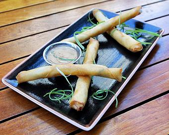 Product: four crispy wonton "chopsticks" are filled with chunk blue crab meat, cream cheese and water chestnuts. served with tangy sweet and sour sauce - Hub 51 in River North - Chicago, IL American Restaurants