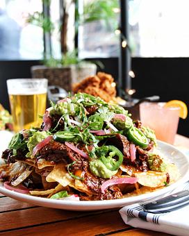 Product: slow braised short rib, guacamole, tomato salsa, jalapeños, cheddar & oaxaca, pickled onion, sour cream - Hub 51 in River North - Chicago, IL American Restaurants