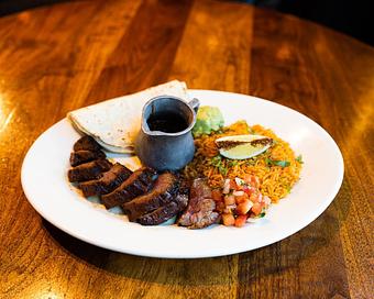 Product: grilled to your liking. tenderloin with a bed of mexican rice. served with warm flour tortillas, pico de gallo, roasted tomato salsa and guacamole - Hub 51 in River North - Chicago, IL American Restaurants