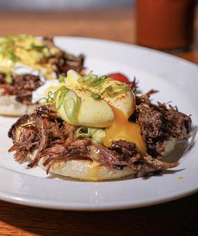 Product: Slow braised short rib, hollandaise sauce poached egg - Hub 51 in River North - Chicago, IL American Restaurants