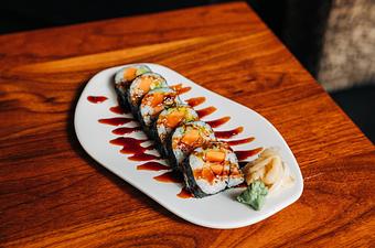 Product: nori seaweed wrapped around sushi rice, tempura fried sweet potato, avocado and yuzu mayo. finished with japanese bbq sauce. sliced into six pieces and served with soy sauce, pickled ginger and wasabi - Hub 51 in River North - Chicago, IL American Restaurants