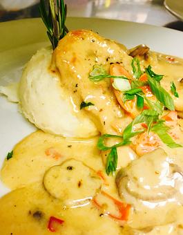 Product: Boneless chicken breast sauteed with sliced mushrooms, tomatoes, red bell peppers, garlic, in a dry Marsala wine sauce. Served over roasted garlic mashed potatoes. - JJ's Restaurant in Kansas City, MO French Restaurants