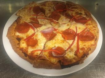Product: Nice thin crust pizza that changes daily.  Come in and try one for yourself. - JJ's Restaurant in Kansas City, MO French Restaurants