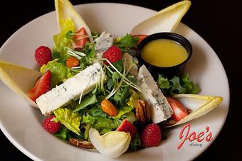 Product: Gorgonzola Dolce with local greens and Belgium Endive, Citrus Vinaigrette - Joes Dining in Santa Fe, NM Pizza Restaurant