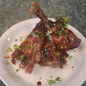 Product: Crispy Garlic, Fresh Herbs and duck Demi Glaze - Kelso Theater Pub and Backstage Cafe in Downtown Kelso Wa. - Kelso, WA American Restaurants