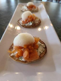 Product: House smoked cured salmon, Herbed cream cheese, carrot roe, topped with a lemon foam - Kelso Theater Pub and Backstage Cafe in Downtown Kelso Wa. - Kelso, WA American Restaurants