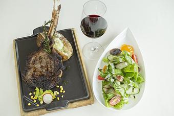 Product: Broad Leaf Wagyu Tomahawk Ribeye and Chef Dan's Seasonal Inspired Salad - Kimball's Kitchen in Duck, NC American Restaurants