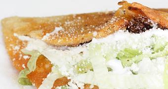 Product: Folded, pan-fried Corn Tortilla of handmade dough with your choice of filling, Lettuce, Cotija Cheese & Sour Cream. - La Lupita Tacos Mexicanos in Olneyville - Providence, RI Mexican Restaurants