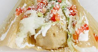 Product: Handmade traditional Cornmeal dough with your choice of filling, served in the husk, with Lettuce, Tomato, Cotija Cheese and Sour Cream - La Lupita Tacos Mexicanos in Olneyville - Providence, RI Mexican Restaurants
