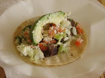 Product: Steak Taco (Supreme) Onion, Cilantro, Lettuce, Tomato, Cotija Cheese & Avocado - La Lupita Tacos Mexicanos in Olneyville - Providence, RI Mexican Restaurants