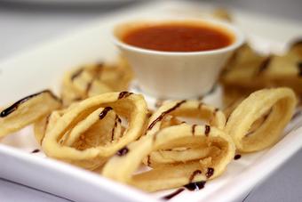 Product: Shallow-fried calamari served with a touch of balsamic glaze & marinara sauce - La Mezzaluna in Princeton, NJ Italian Restaurants