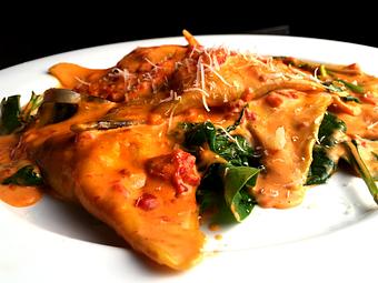 Product: Fresh lobster & ricotta Ravioli served in a creamy tomato sauce with fresh spinach - La Mezzaluna in Princeton, NJ Italian Restaurants
