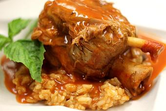 Product: Slow-cooked pork shank served over a wild mushroom risotto - La Mezzaluna in Princeton, NJ Italian Restaurants