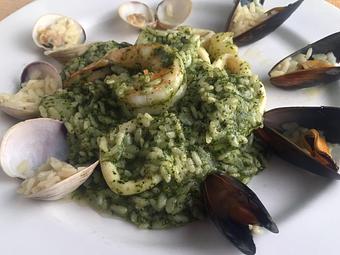 Product: Risotto cooked in a pesto sauce with jumbo shrimp, bay scallops, calamari & mussels - La Mezzaluna in Princeton, NJ Italian Restaurants